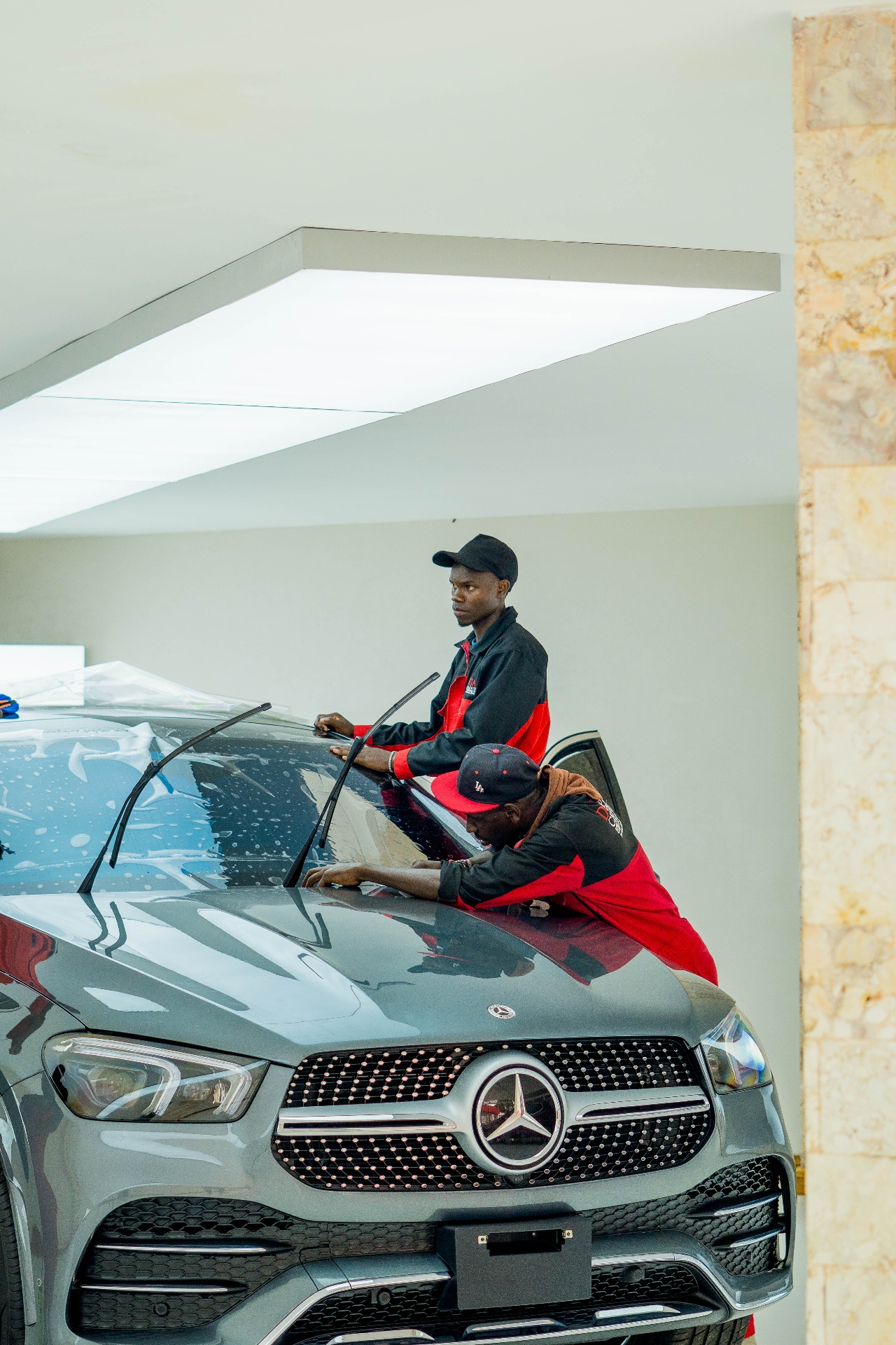 Donga team applying windscreen protection film on a Mercedes GLE Coupé